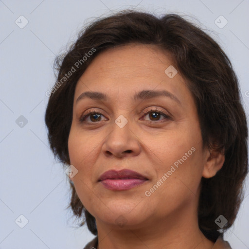 Joyful white adult female with medium  brown hair and brown eyes