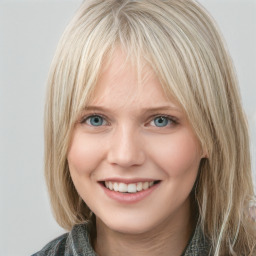 Joyful white young-adult female with medium  brown hair and blue eyes