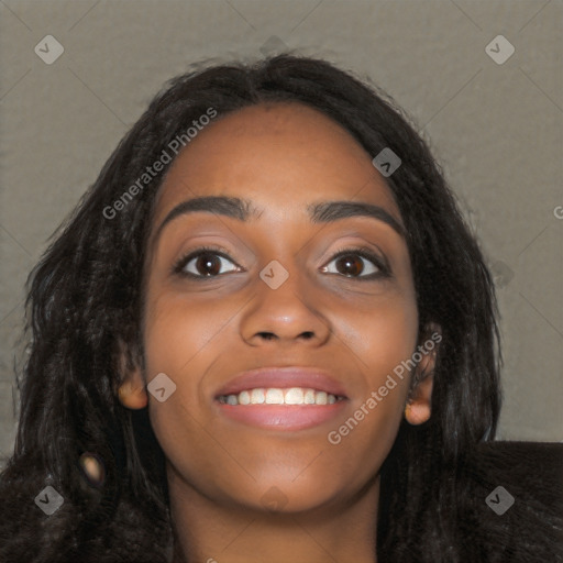 Joyful black young-adult female with long  black hair and brown eyes