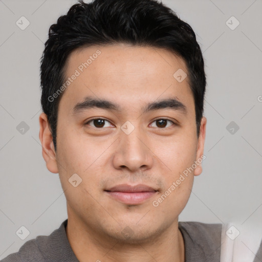 Joyful asian young-adult male with short  black hair and brown eyes