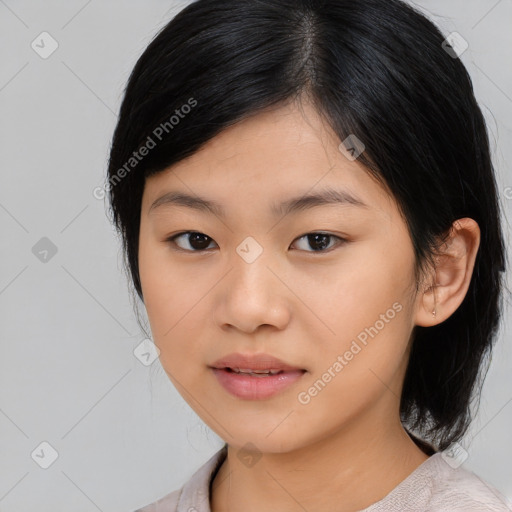 Joyful asian young-adult female with medium  black hair and brown eyes