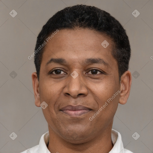 Joyful latino adult male with short  black hair and brown eyes