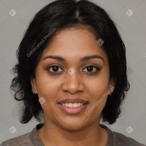 Joyful black young-adult female with medium  brown hair and brown eyes