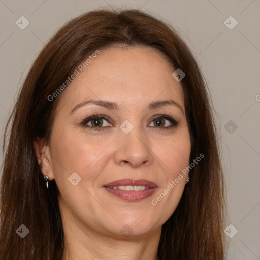 Joyful white adult female with long  brown hair and brown eyes