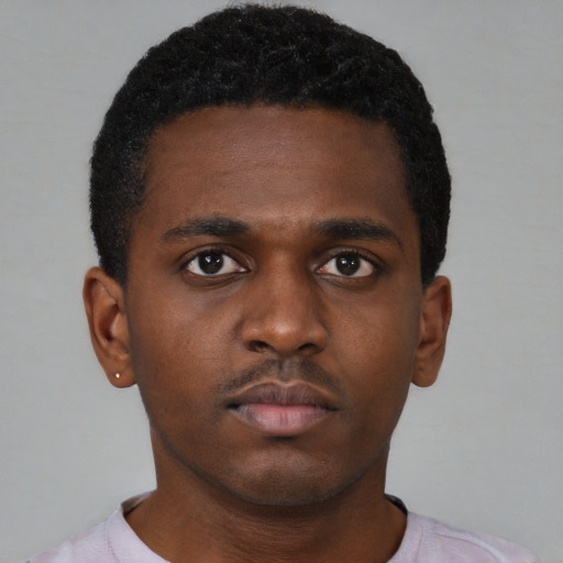 Neutral black young-adult male with short  brown hair and brown eyes