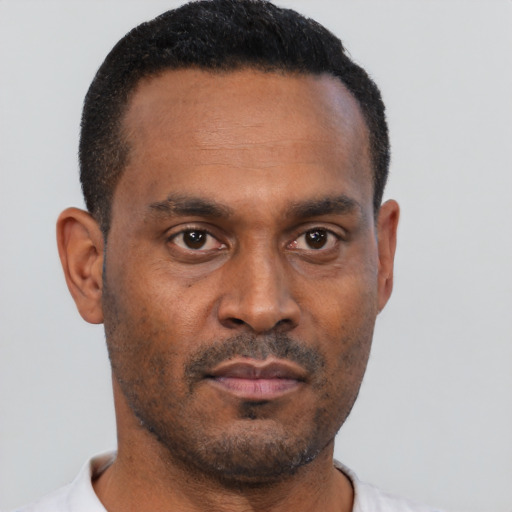 Neutral black adult male with short  black hair and brown eyes