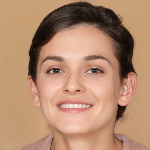 Joyful white young-adult female with medium  brown hair and brown eyes