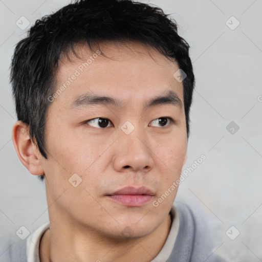 Neutral asian young-adult male with short  brown hair and brown eyes