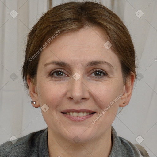 Joyful white adult female with medium  brown hair and grey eyes