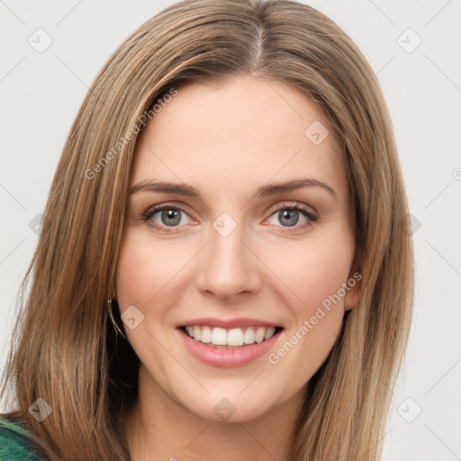 Joyful white young-adult female with long  brown hair and green eyes