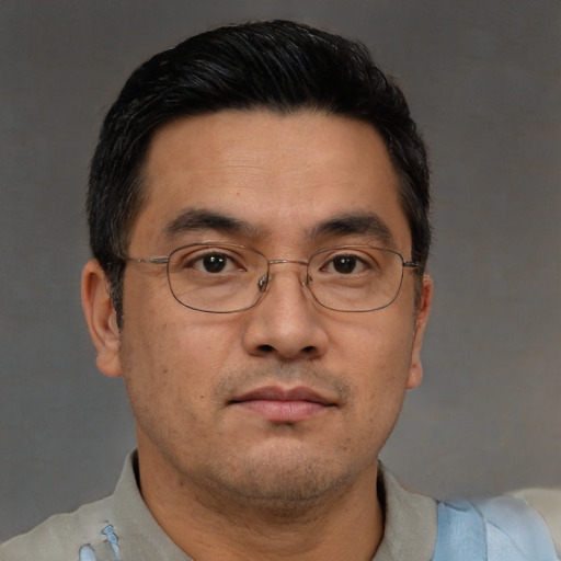 Neutral asian adult male with short  black hair and brown eyes