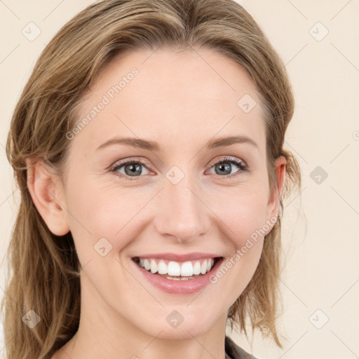 Joyful white young-adult female with medium  brown hair and blue eyes