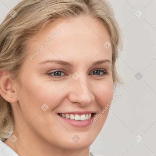 Joyful white young-adult female with medium  brown hair and blue eyes