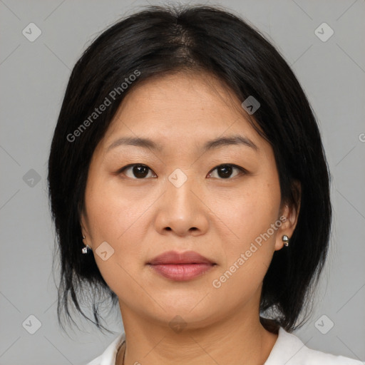 Joyful asian young-adult female with medium  black hair and brown eyes