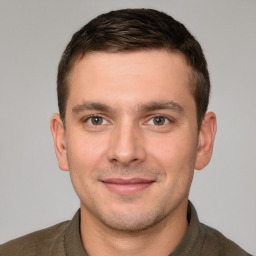 Joyful white young-adult male with short  brown hair and brown eyes