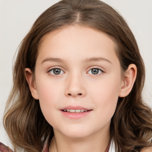 Joyful white child female with long  brown hair and brown eyes