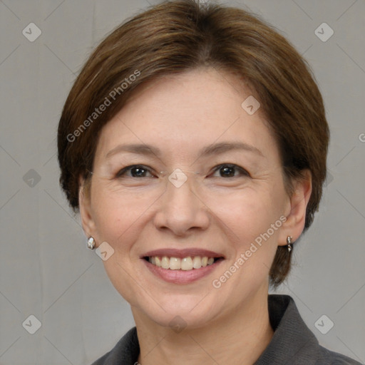 Joyful white adult female with medium  brown hair and grey eyes