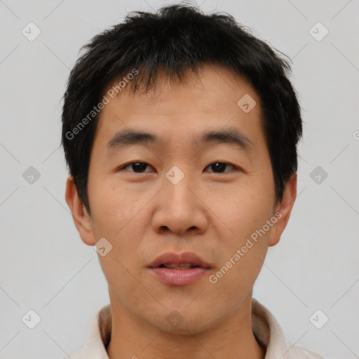 Neutral asian young-adult male with short  brown hair and brown eyes