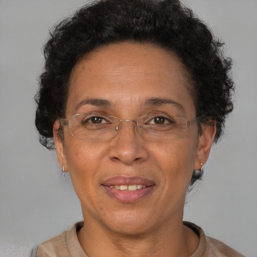 Joyful black adult female with short  brown hair and brown eyes