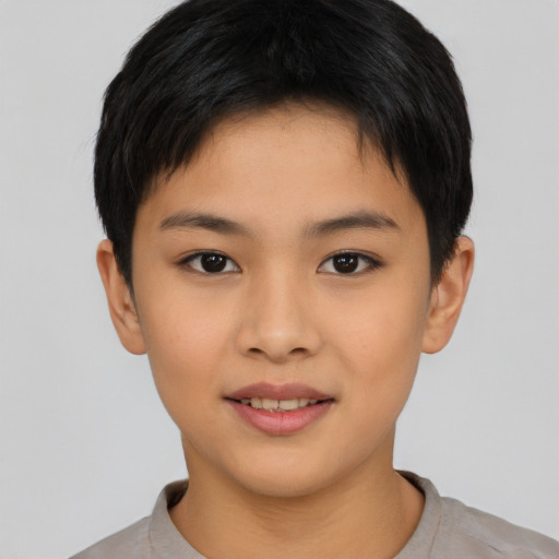Joyful asian child female with short  brown hair and brown eyes