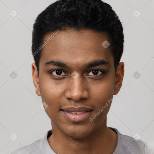 Joyful black young-adult male with short  black hair and brown eyes