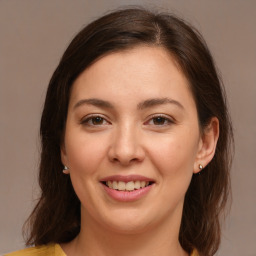 Joyful white young-adult female with medium  brown hair and brown eyes