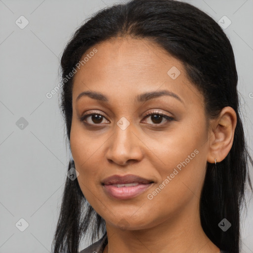 Joyful latino adult female with long  brown hair and brown eyes