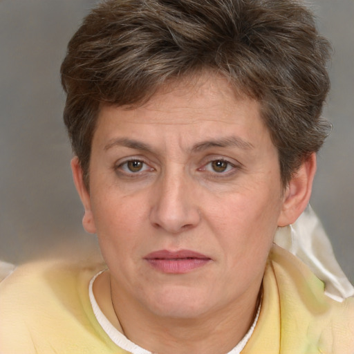 Joyful white adult female with short  brown hair and brown eyes