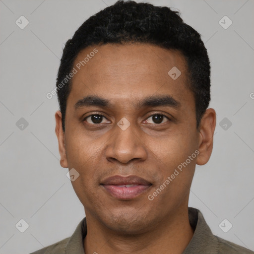 Joyful black young-adult male with short  black hair and brown eyes