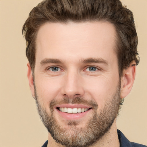 Joyful white young-adult male with short  brown hair and brown eyes