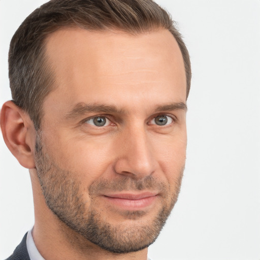 Joyful white adult male with short  brown hair and brown eyes