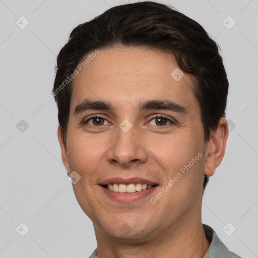 Joyful white young-adult male with short  brown hair and brown eyes