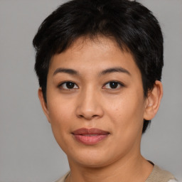 Joyful asian young-adult female with short  black hair and brown eyes