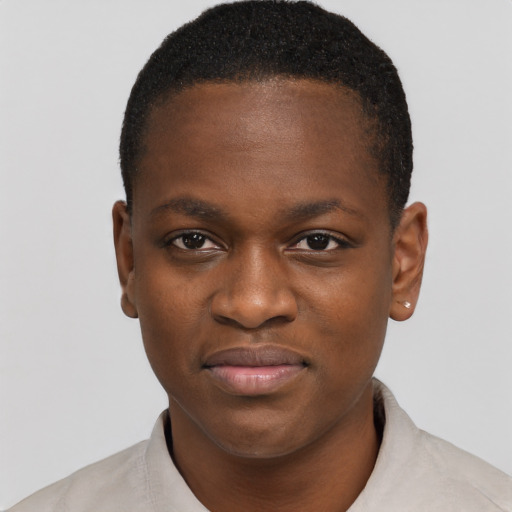 Joyful black young-adult female with short  brown hair and brown eyes