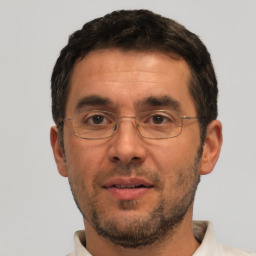 Neutral white adult male with short  black hair and brown eyes
