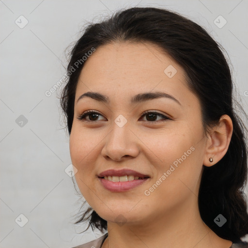 Joyful latino young-adult female with medium  brown hair and brown eyes