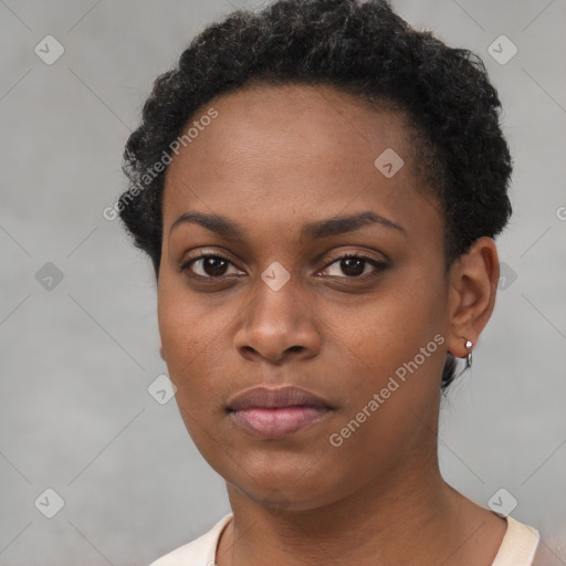 Neutral black young-adult female with short  black hair and brown eyes