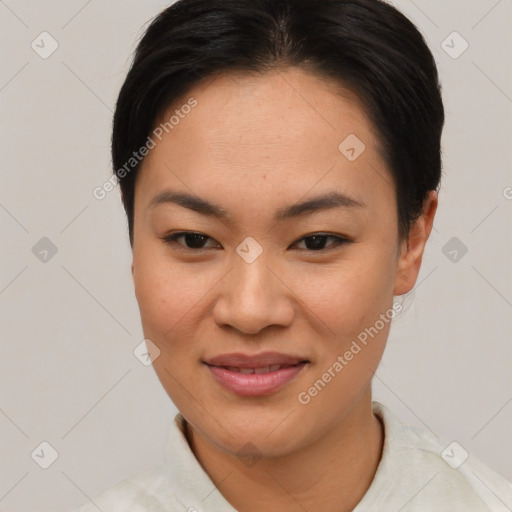 Joyful asian young-adult female with short  brown hair and brown eyes