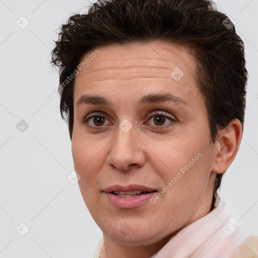 Joyful white adult female with short  brown hair and brown eyes