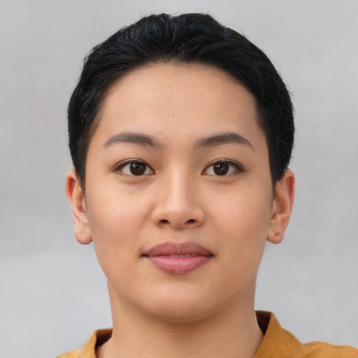 Joyful asian young-adult female with short  black hair and brown eyes