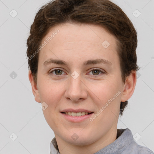 Joyful white young-adult female with short  brown hair and grey eyes