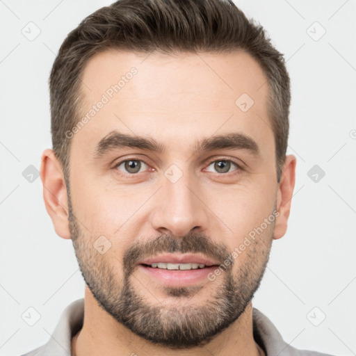 Joyful white young-adult male with short  brown hair and brown eyes