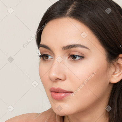 Neutral white young-adult female with long  brown hair and brown eyes