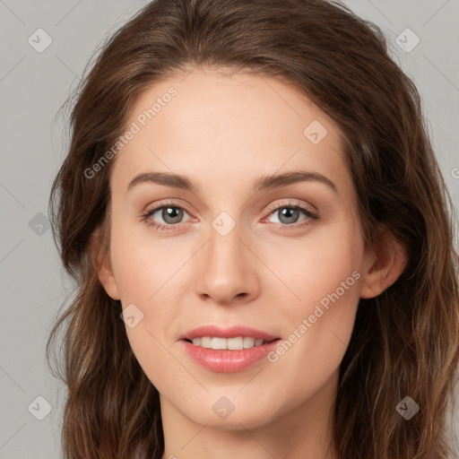 Joyful white young-adult female with long  brown hair and green eyes