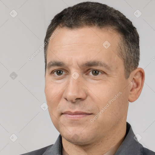 Joyful white adult male with short  brown hair and brown eyes