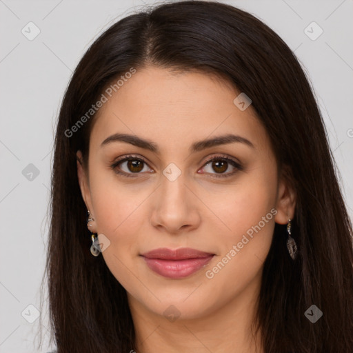 Joyful latino young-adult female with long  brown hair and brown eyes