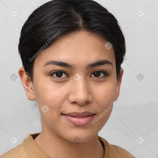 Joyful latino young-adult female with short  brown hair and brown eyes