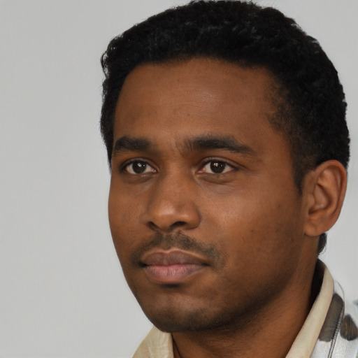 Neutral black young-adult male with short  black hair and brown eyes