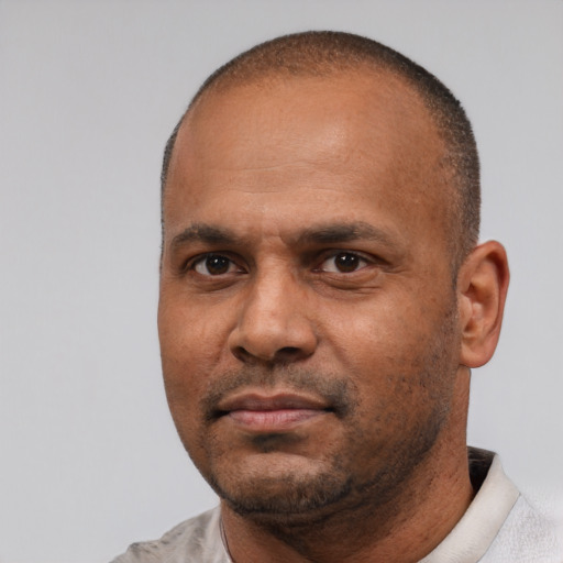 Neutral latino adult male with short  black hair and brown eyes