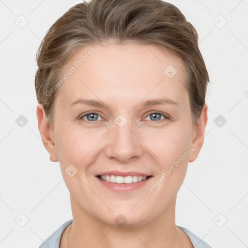 Joyful white young-adult female with short  brown hair and grey eyes